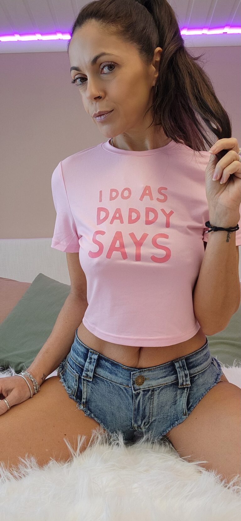 Innocent looking Angelina with pink t-shirt