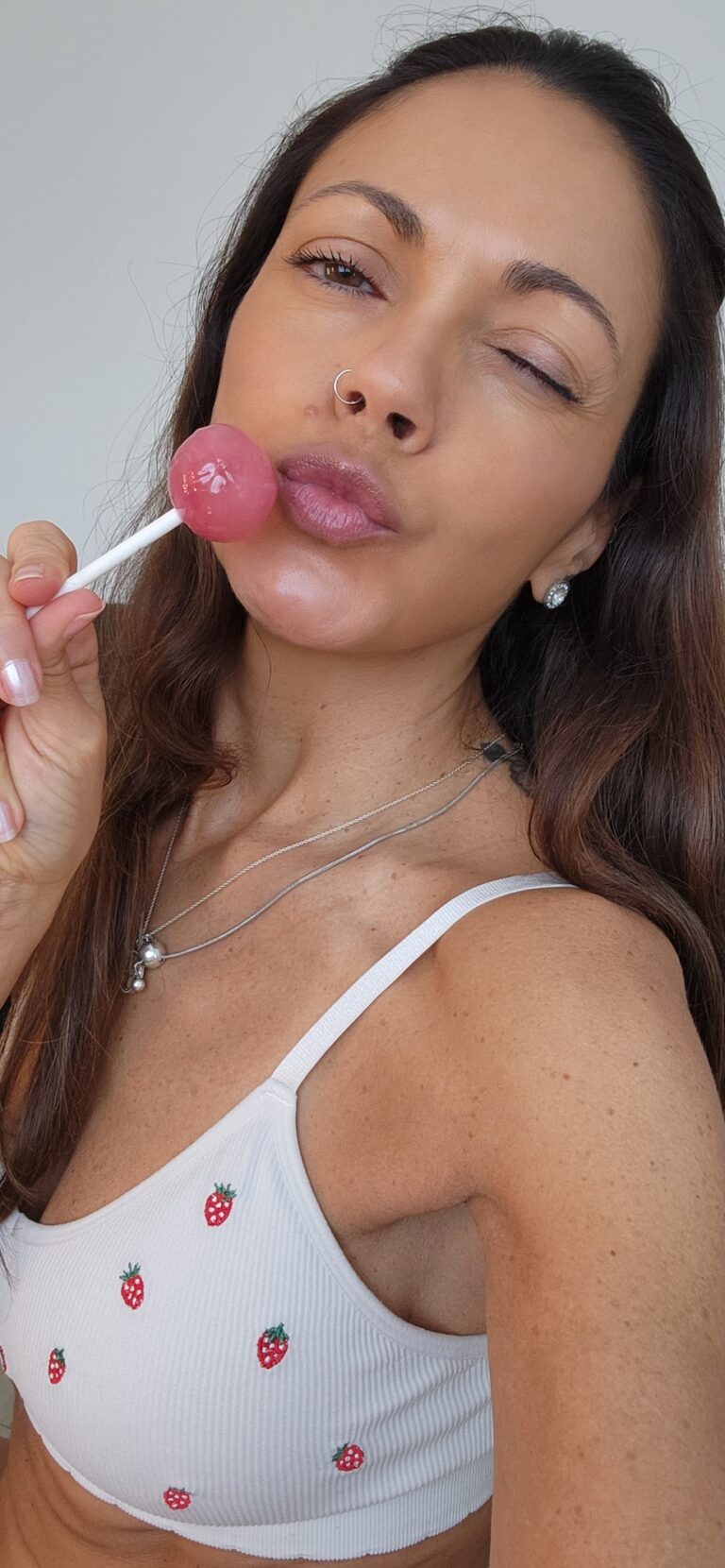 Angelina is looking seductive with a lollipop